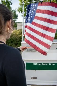 Over the Shoulder View of Voter Using Official Ballot Drop Box Fotos Stock