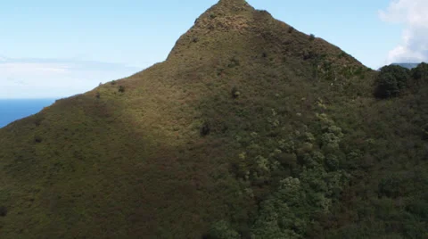 Over steep hill to a view of Molokai coastline. Shot in 2010. Stock Footage 59520876