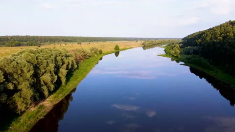 Over summer river, field and wood. Aerial landscape with clouds reflections Stockbeeldmateriaal 165604298