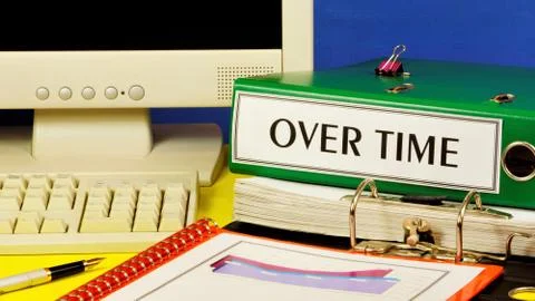 Over time-a text label on the office Registrar folder. Stock Photos