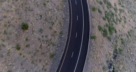 Over a Twisting Highway Up a Mountain Side Stock Footage 133646803