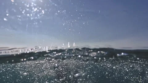 Over-under view of man swimming with diving fins slow motion Stock Footage 279868880