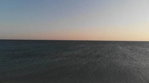 Over the vast expanses of the evening sea Stock Footage 133369722