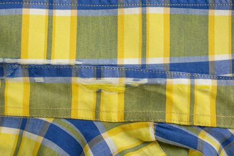Over worn and torn checkered shirt, obsolete clothes abstract  backdrop Foto stock