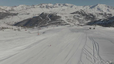 Overall drone tracking skier with mountain Video stock 345801436