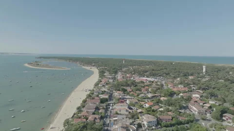 Overall drone view of Cap Ferret with lighthouse in distance, France Stock Footage 333107619