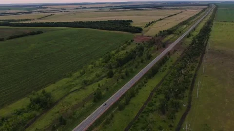 Overall plan of the road with green fields. top view, panarama. camera movement Stock Footage 145466029