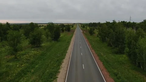 Overall plan of the road with green fields. top view, panarama. camera movement Stock Footage 145466033