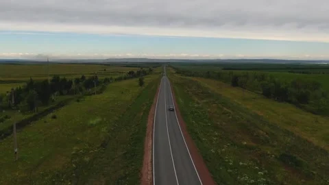 Overall plan of the road with green fields. top view, panarama. camera movement Stock Footage 145466047
