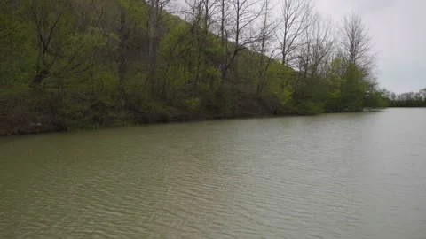 Overcast and rainy landscape of a tranquil lake. Natural scene Stock Footage 319792000