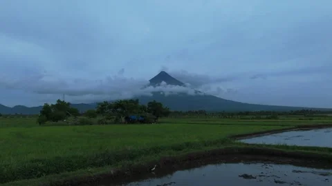 Overcast clouds covers the peak of Mt Mayon. Ideal for tourism and travel Stock Footage 336011376
