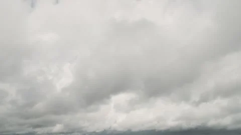 Overcast clouds moving across the gray sky timelapse Stock Footage 340321631