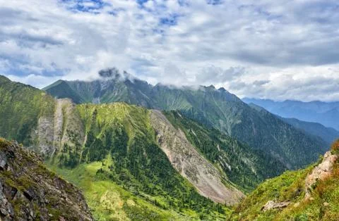 Overcast clouds over mountain ranges. The state of nature before rain. Easter Stock Photos