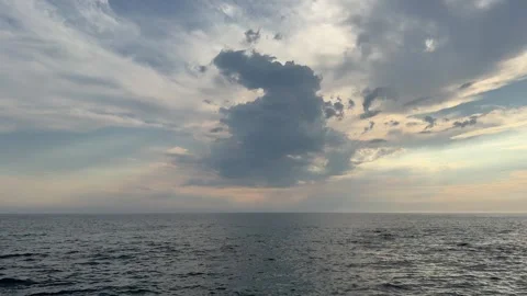 Overcast clouds over the tranquil ocean water Video stock 313300155