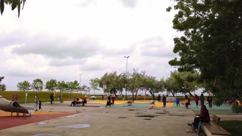 Overcast, cloudy day. modern children's playground in open air on promenade. Stock Footage 134595374