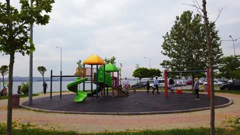 Overcast, cloudy day. modern children's playground in open air on promenade. Stock Footage 134595409