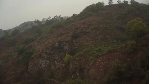 Overcast day on the beach with the small waves and muddy water 動画素材 169522513