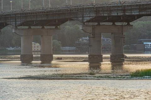 Overcast day, large bridge with multiple spans, immersed pillars, floating ve Stock Photos
