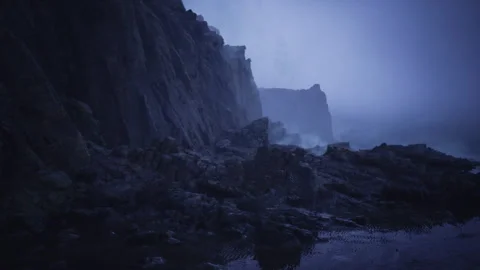 Overcast fog surrounds rugged cliffs adjacent to serene reflective pools Stock Footage 341832999