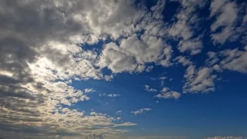 Overcast rare pretty white clouds in the summer sky - photo of nature 写真素材