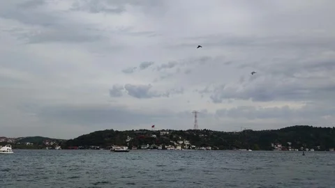 Overcast Sky and Cloudy View of the Bosphorus Strait with Boats and Istanbul Stock Footage 323093385
