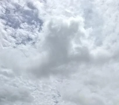 Overcast Sky Covered in Dense White and Grey Clouds 스톡 사진