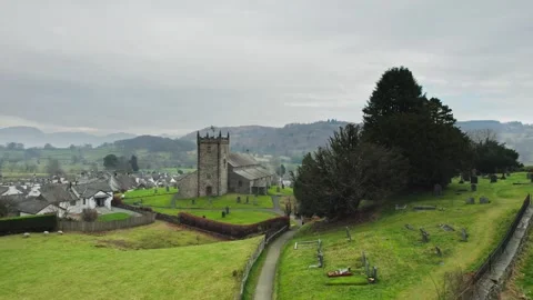Overcast sky drapes ancient stone church Stock Footage 345651304