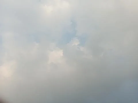 Overcast sky filled with soft white and gray clouds Stock Photos