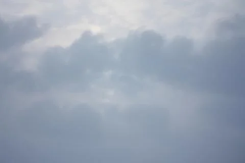 Overcast sky filled with thick gray cumulus clouds Stock Photos