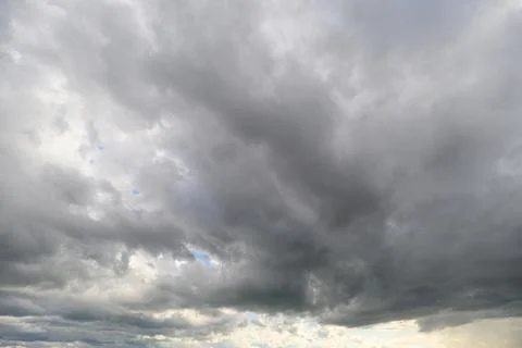 The overcast sky is filled with various gray shades, creating a captivating.. Stock Photos