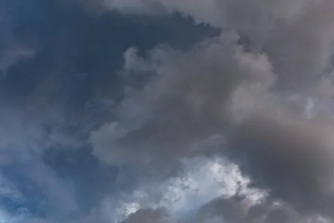 Overcast sky, full-frame gray clouds background and texture Stock Photos