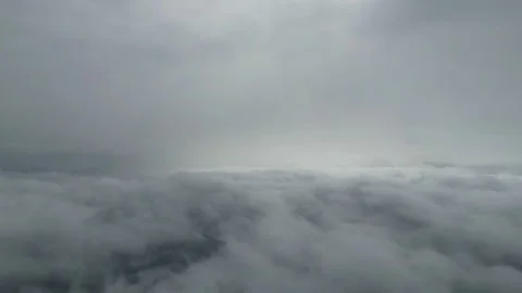 Overcast sky with thick clouds covering landscape, gradual lightening visible Stock Footage 336963739