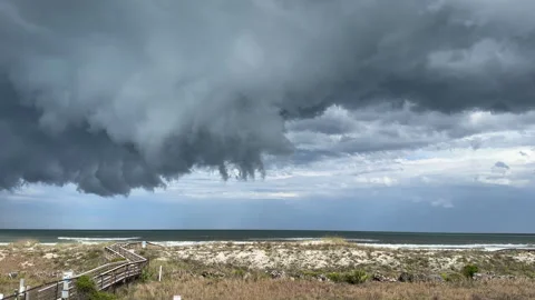 Overcast sky with threatening storm clouds, foreboding beach weather Stock Footage 292764894