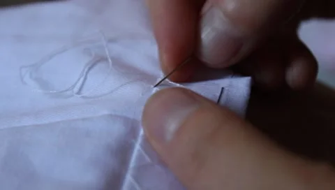 Overcast stitch by hand - sewing Stock Footage