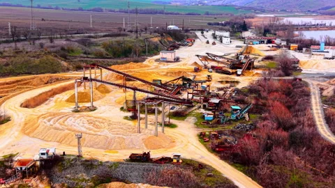 Overcast view of quarry complex and surrounding fields, Bulgaria Stock Footage 341761533