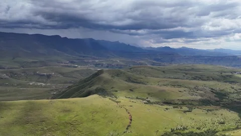 Overcast Weather Casting Shadows As Winding Trail Stretches Towards Distant Stock Footage 335240314