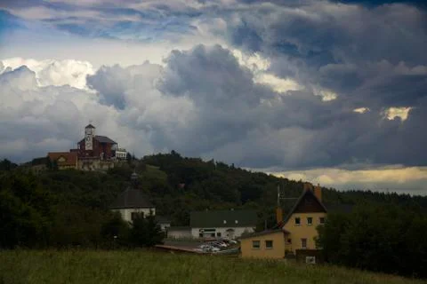 The overcasting dramatic sky over Komari Vizka Building Stock Photos
