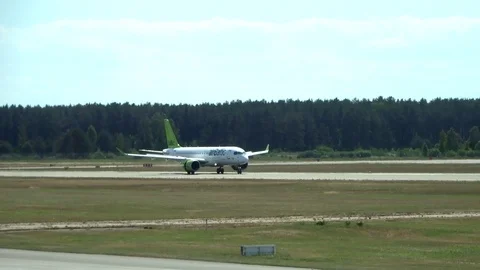 Overclocking of the Air Baltic on the runway Stock Footage 95567096