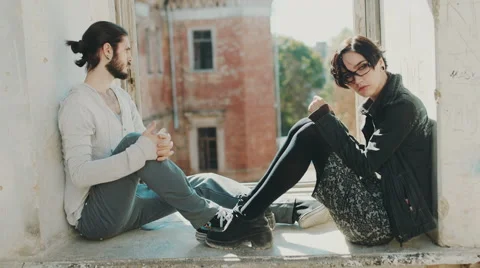 Overcome the crisis in the relationship. Young man and woman hold hands. Sit on Stock Footage