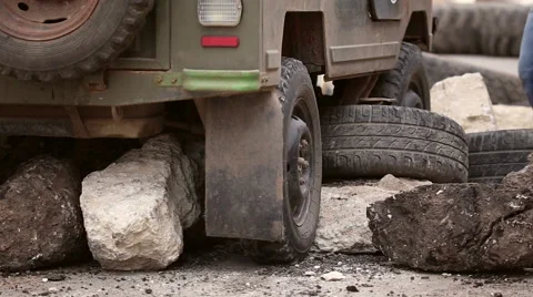 Overcoming roadblocks during car trial 4x4 Stock Footage 64570179