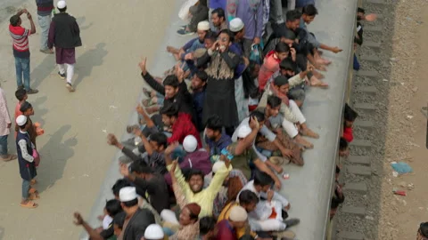 Overcrowded Train with People Riding on Its Roof Departs from Dhaka, Bangladesh Stock Footage 235949474