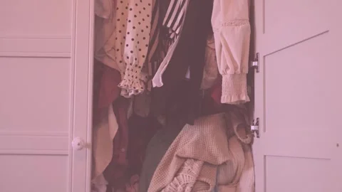 Overcrowded wardrobe packed with clothes hangers, excess garments limited s.. Stock Footage 335085257