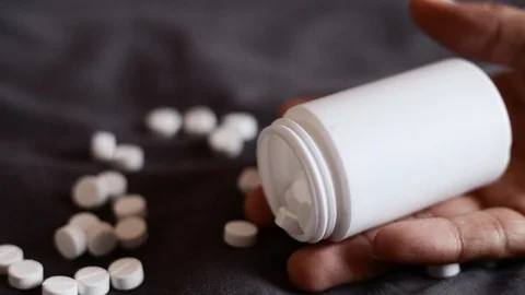 Overdose, close up pills in young men hands Stock-Footage 115232603