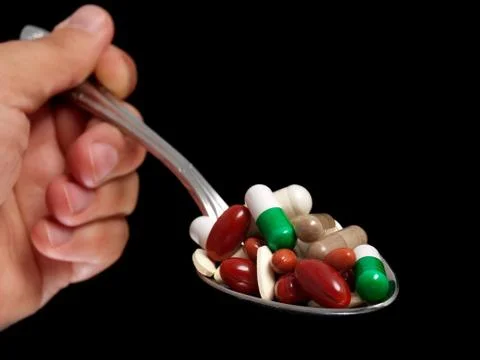 Overdosing spoon Stock Photos