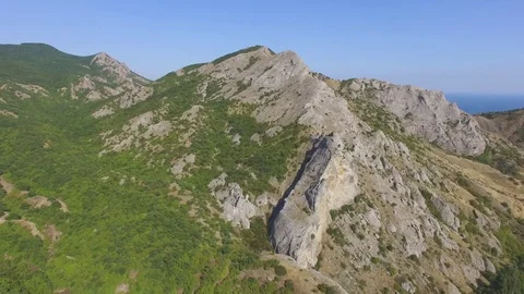 Overflight above rocky cliffs, aerial video Stock Footage 80986086