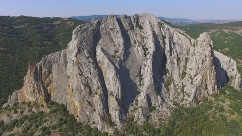 Overflight above rocky cliffs, aerial video Stock Footage 80989453