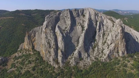 Overflight above rocky cliffs, aerial video Stock Footage 80989624
