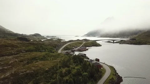 Overflight of cabins and road, view of bridge and mountains in Norway Stock Footage 224138688