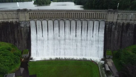 Overflow dam drone flight in the direction of the dam wall with sound recording Stock Footage