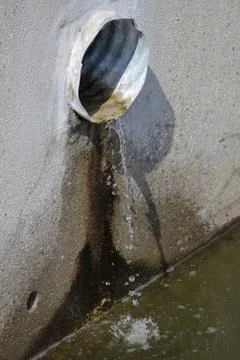 Overflow pipe with rainwater draining Stock Photos